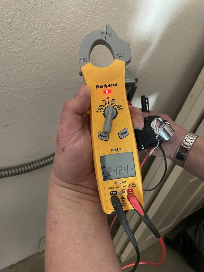 Voltage testing with clamp meter during Whole House Surge Protector in Richland Center